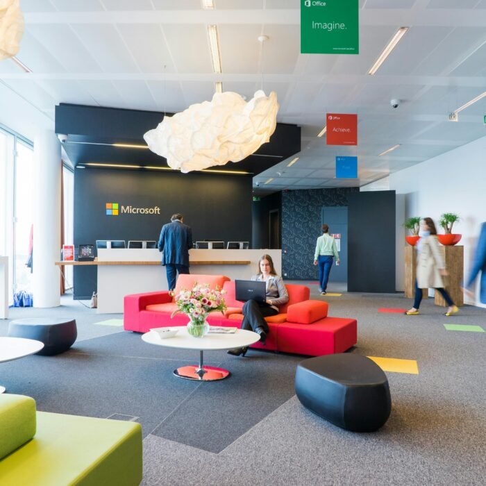 Contemporary office reception area with vibrant seating and professional ambiance.